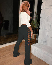 Load image into Gallery viewer, Hot selling solid color eyelet flared trousers